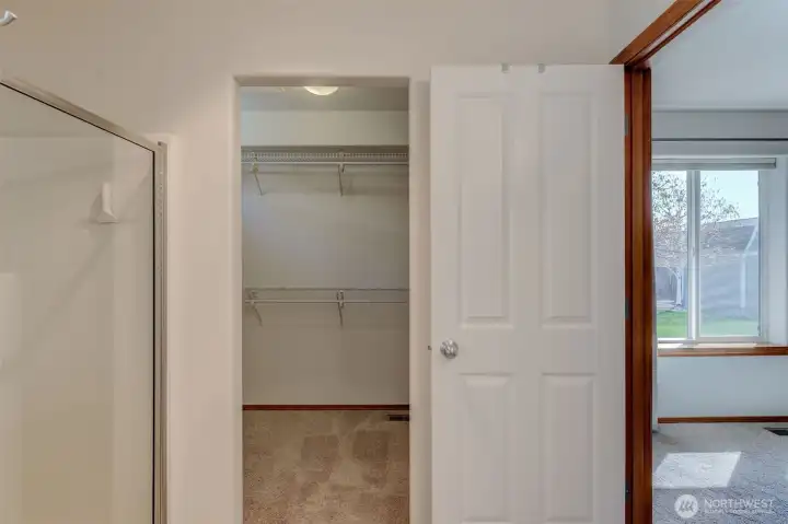 Primary suite offers dual closets plus walk-in closet for exceptional storage and organization.