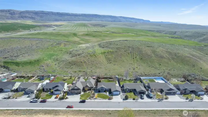 Backyard opens to a stunning natural canyon, offering peaceful views and added privacy.