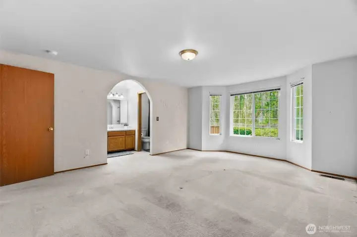 Primary bedroom view into on-suite bath.