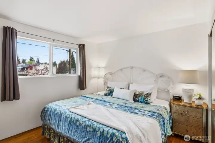 Primary bedroom overlooks front yard