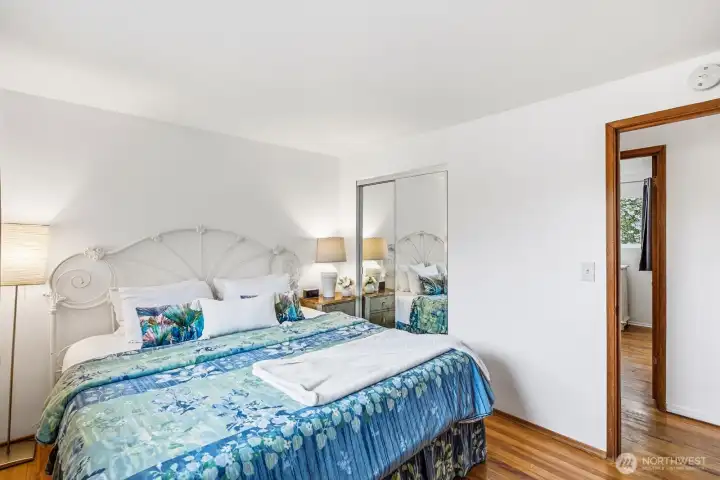 Primary bedroom overlooks front yard