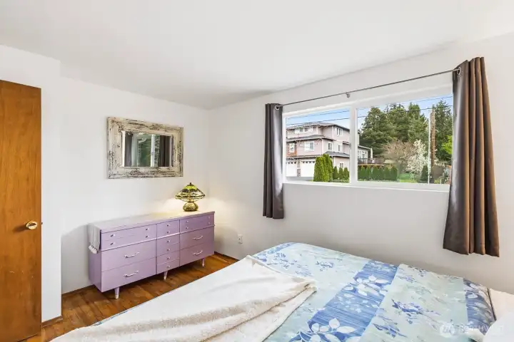 Primary bedroom overlooks front yard