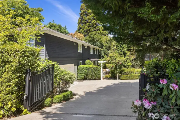 Outside, the private backyard offers a beautiful escape with a level lawn, mature landscaping and spaces to relax, play and entertain. Outside, the private backyard offers a beautiful escape with a level lawn, mature landscaping and spaces to relax, play and entertain.