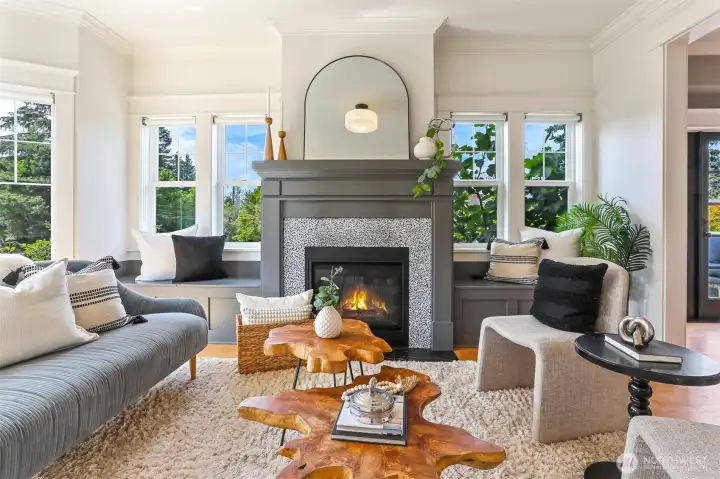 Formal Living room with one of four gas fireplaces welcomes you into this beautiful home!