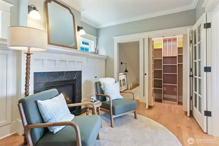 Cozy den/flex area of the kitchen with custom built-in pantry.