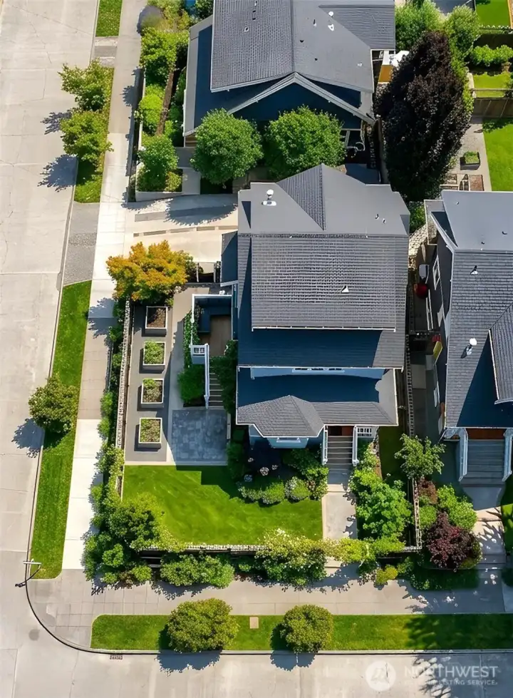 Large, fully fenced yard with raised beds, garden areas & room for Fido!