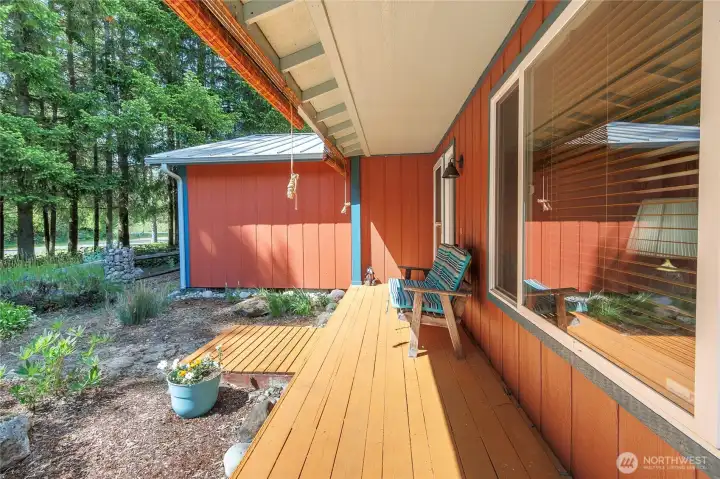 Enjoy the view through the woods from your covered front deck