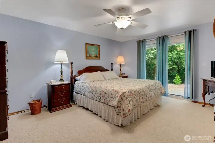 Primary bedroom with slider doors to back deck