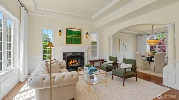 Marble surround gas fireplace, column details, gorgeous millwork, and inlayed crown molding are highlighted by the abundant windows. Marble surround gas fireplace, column details, gorgeous millwork, and inlayed crown molding are highlighted by the abundant windows.
