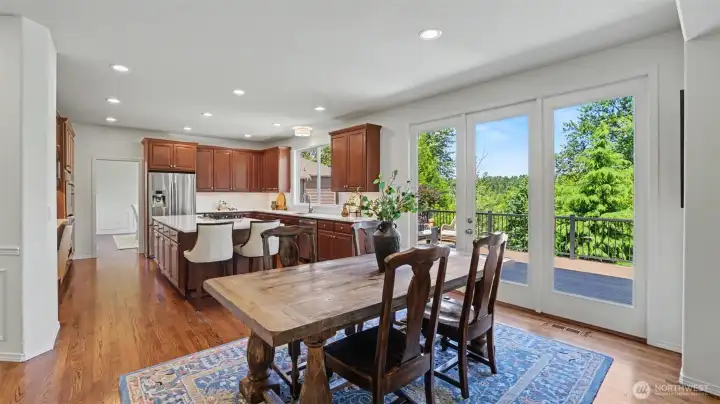 The casual dining area flows seamlessly between the kitchen and family room, with French door access to the deck. The casual dining area flows seamlessly between the kitchen and family room, with French door access to the deck.