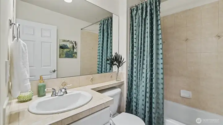 Full bath located off the main-floor bedroom Full bath located off the main-floor bedroom