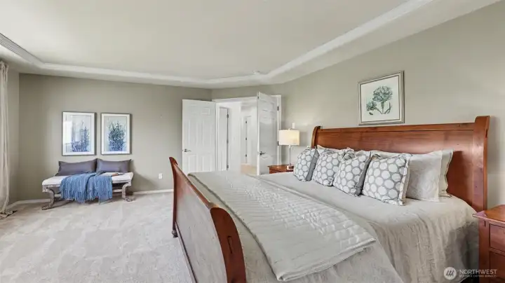 The spacious primary suite features his and hers walk-in closets and sitting area The spacious primary suite features his and hers walk-in closets and sitting area