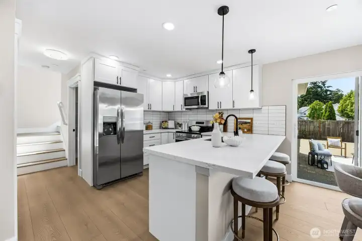 Open kitchen to enjoy family room and have coffee at the quartz counter bar