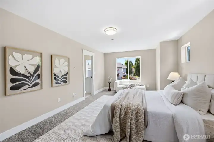 Primary bedroom with beautiful lighting, new carpet, pain, trim and lighting