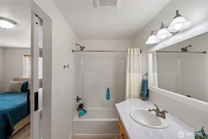 Brand new full bath in the lower level bathroom suite.