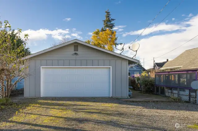 The garage is oversized an attached with additional parking off the alley.