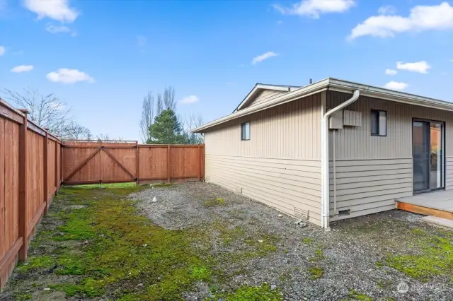 south side of home side yard with large opening gate. boat or extra car storage