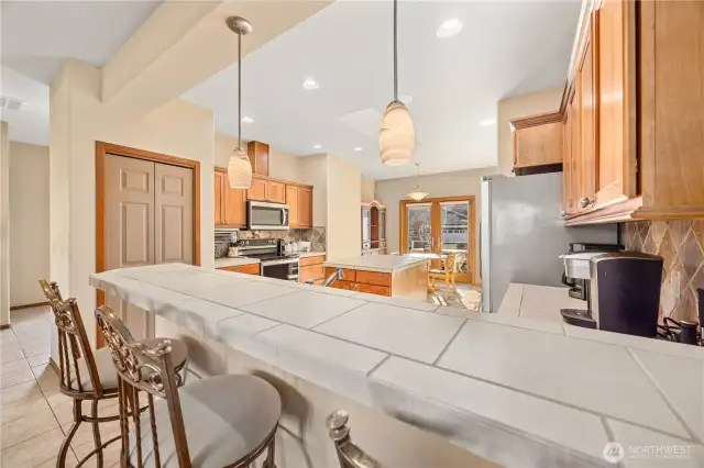 Entertainers kitchen with bar seating.