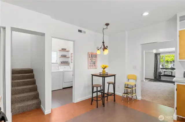 Kitchen opens to laundry room