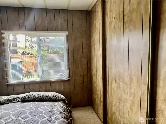 guest bedroom also has a wall of closets