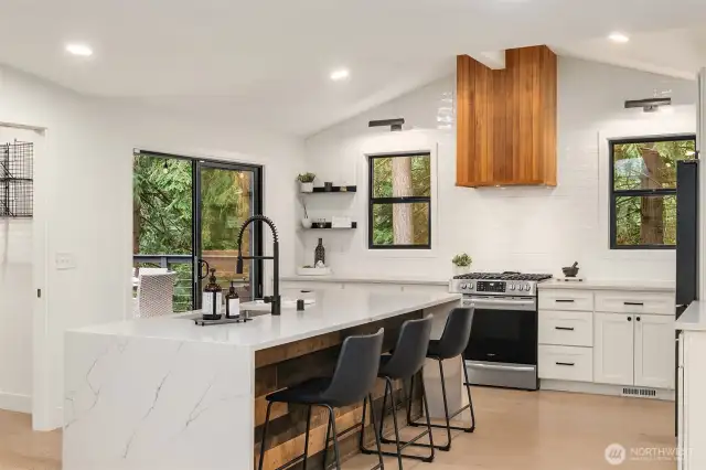 Updated, bright kitchen with oversized island for entertaining or eating.