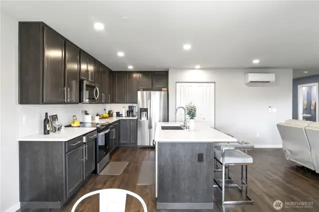 Tons of storage, a deep sink and lots of counterspace make cooking fun! Full Kitchen pantry too!