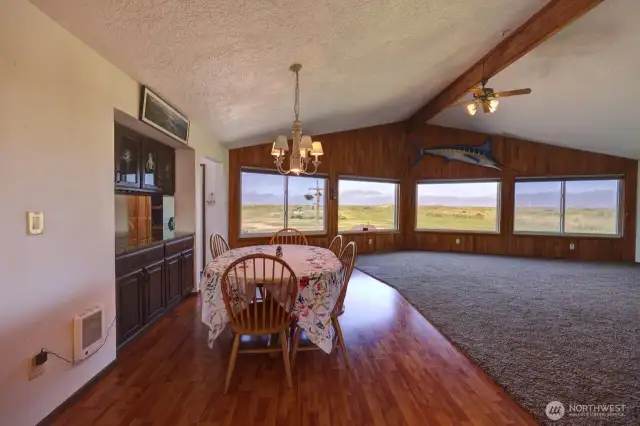 Dining room and great room with build in cabinetry and spectacular ocean view.