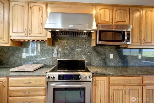 Updated kitchen with tile floors, Hickory Cabinetry and quartz counter tops. Lots of custom details.