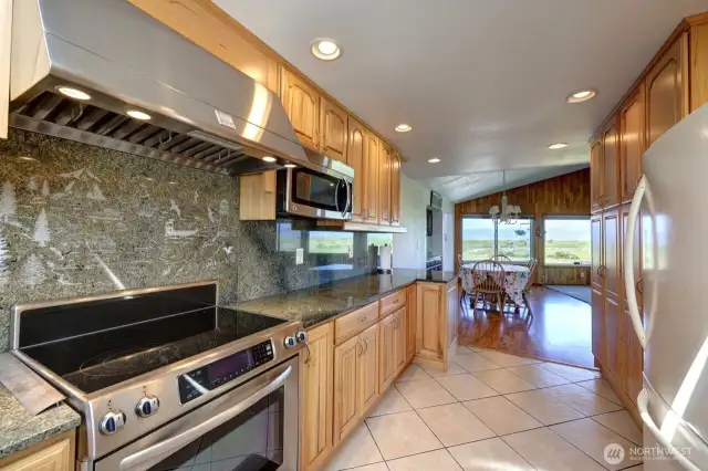 Updated kitchen with tile floors, Hickory Cabinetry and quartz counter tops. Lots of custom details.