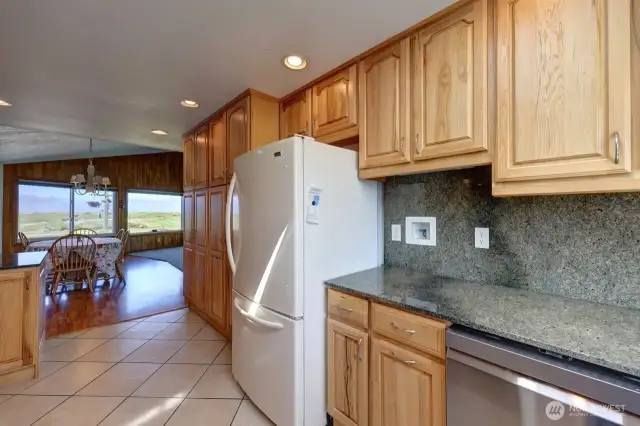 Updated kitchen with tile floors, Hickory Cabinetry and quartz counter tops. Lots of custom details.