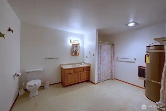 Main floor 3/4 bathroom with laundry and utility room.