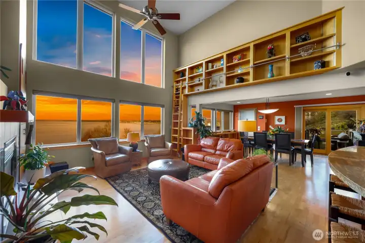 Open concept living while keeping your home cozy, built in shelving with ladder for access stunning fireplace and 20 foot ceilings in main living area.