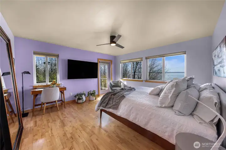 Off the kitchen and main living is the primary bedroom for easy single floor living. This spacious room is filled with natural light and water views! Enjoy your own private patio with lots of wildlife to watch!