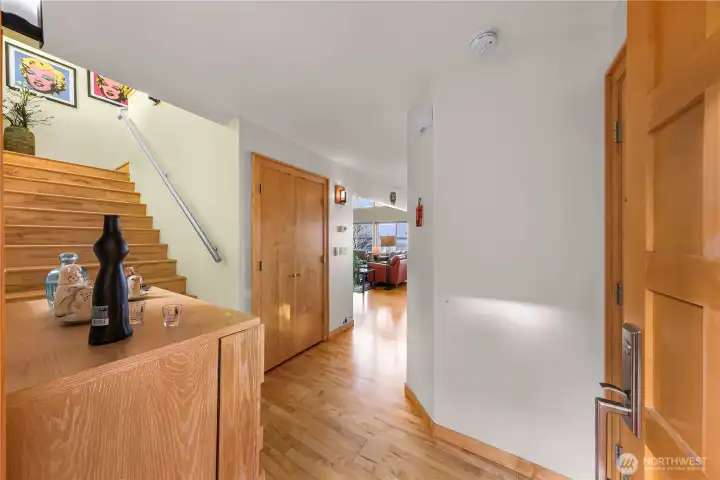 Main entry leading to stairway, laundry and guest bath