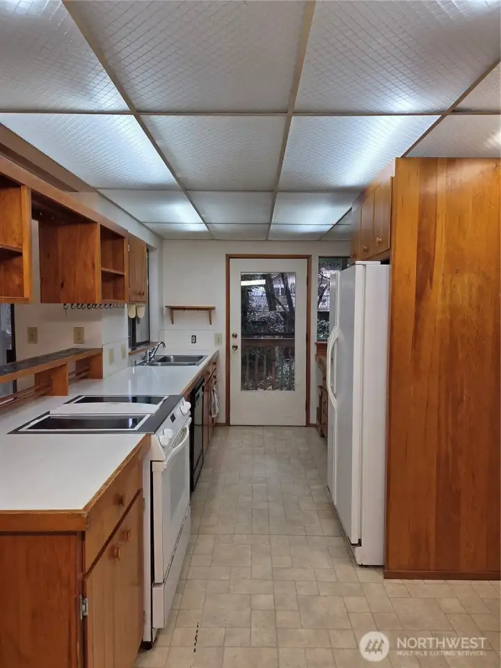 Kitchen view one, with door out to the deck.