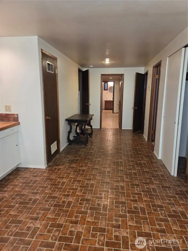 Extra area with sink and more storage at the bottom of the stairs, and tons more storage.