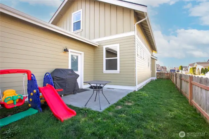 Corner lot with nice lawn and patio.