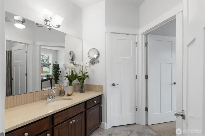 The second full bathroom can be accessed from both the hallway and the den.