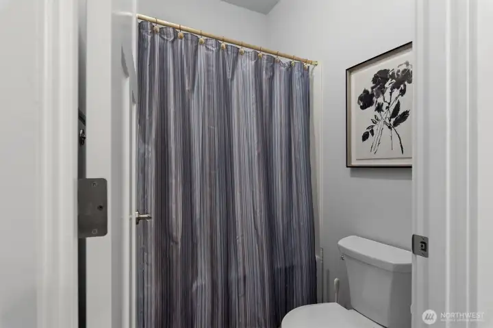 The second bathroom has a shower/tub combination.