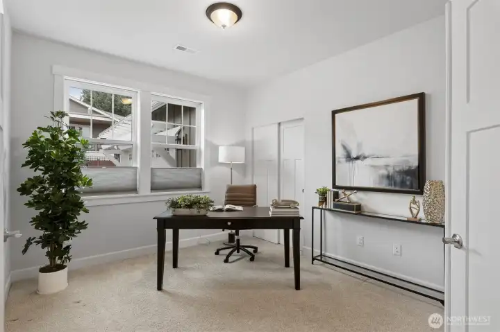 The den with double doors, closet and access to the second bathroom. This is a flexible room and could be used as a bedroom or office as well.