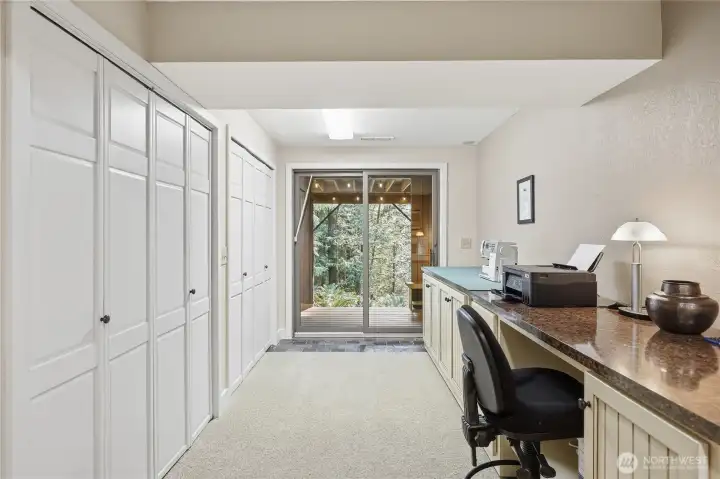 The lower level area currently used for sewing. Note the extensive storage all along the wall.