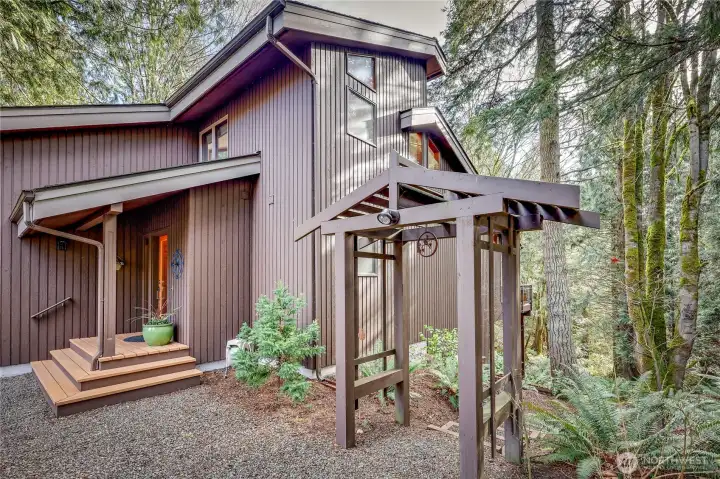 Go through the gazebo and a set of stairs will take you around the house to the lower level.