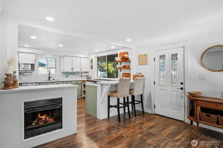 A welcoming kitchen and eating bar that flows naturally into the living area.