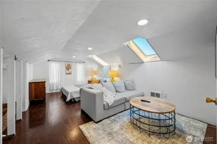 Staircase leads to a spacious open area perfect for a variety of living needs.