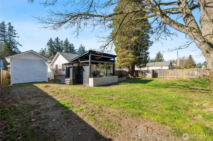 Double gate that opens for access to the large freshly painted covered Carport for RV, Boat, Toys or more. Large shed is situated right behind for great storage!