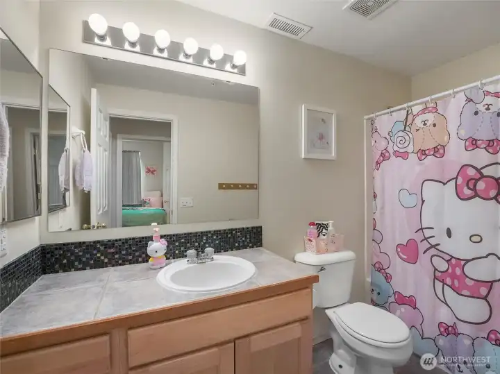 The hall bathroom has a full tub and shower.