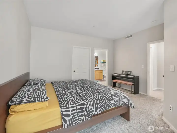 Primary bedroom also includes a ceiling fan.