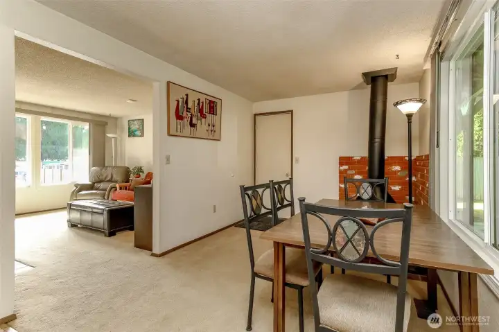 Family room with fireplace that flows into the living room.