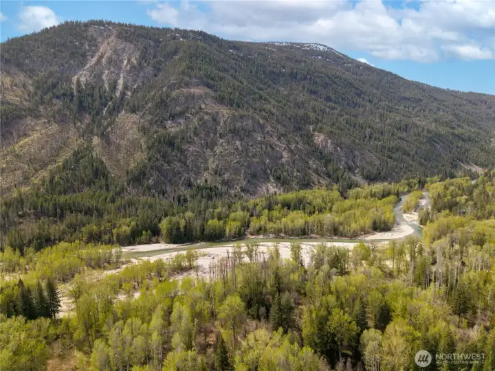 Accross Lost River Road, flows the beautiful Methow River.  Just a short walk from the subject property.