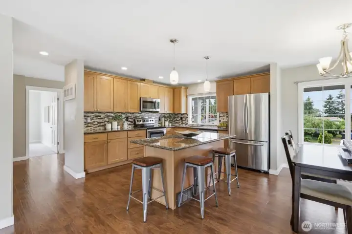 updated kitchen with granite countertops.
